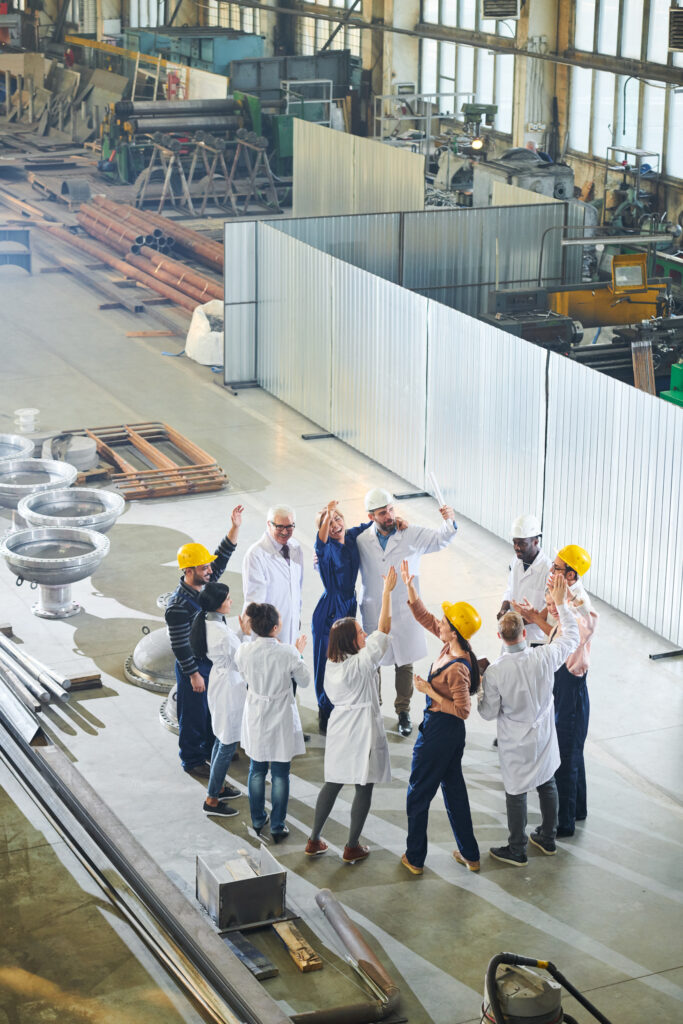 group of factory workers celebrating 2026 01 08 06 29 39 utc