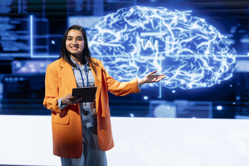 happy presenter talking at ai summit using mic and 2026 01 08 02 31 14 utc